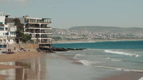 Beach,-sea-shore-and-waves-in-Taghazout,-Agadir,-Morocco