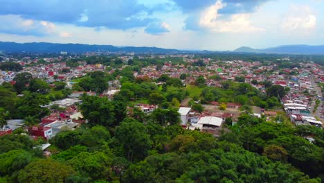 beautiful-aerial-view-with-drone-of-urban-forest-and-the-city-of-Cordoba,-Veracruz,-Mexico