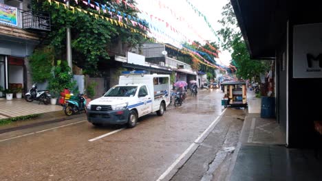 Traffic,-motorbikes-and-tricycles-on-the-streets-of-Coron-Town-in-Palawan,-Philippines,-Southeast-Asia