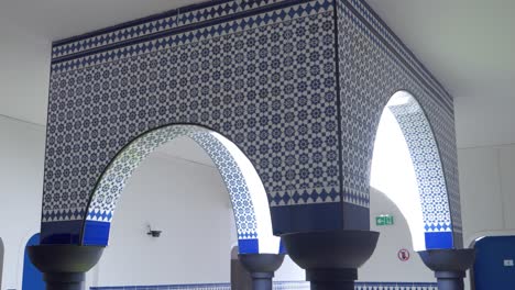 Slow-rotating-shot-of-a-tiled-archway-architecture-within-a-spa-resort-in-France