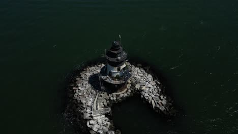 An-aerial-view-the-Orient-Point-lighthouse-off-the-east-end-of-Orient-Point,-NY-on-a-sunny-day
