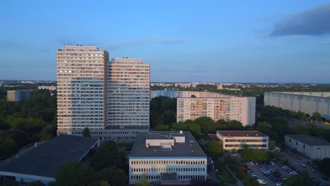 Magic-aerial-top-view-flight-prefabricated-housing-complex,-Panel-system-building-Berlin-Marzahn-Germany-Europe-summer-23