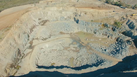 stone-quarry-overview-aerial,-sunny-weather,-big-gravel-pit-drone-flyover-shot
