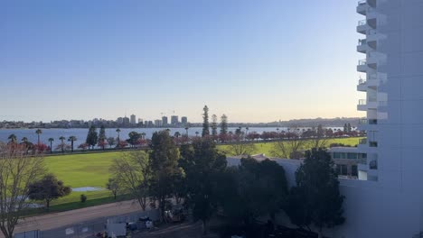 View-from-East-Perth-over-Langley-Park-and-Riverside-Drive-with-line-of-Flame-Trees-along-cycle-path-on-the-Swan-River