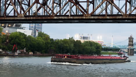 A-Barge-Ship-Under-Clay-Wade-Bailey-Bridge-In-Covington,-Kentucky-In-United-States