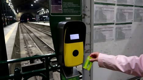 Female-hand-validates-a-train-ticket-at-Sao-Bento-Station-in-Porto