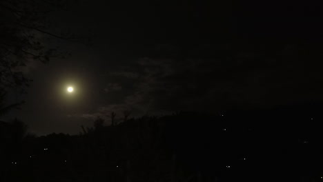 Clouds-drift-across-dark-sky-in-black-night-moon-rise-time-lapse
