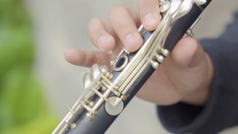 Close-Up-View-of-Musician-Fingers-Playing-Clarinet-Music-Instrument