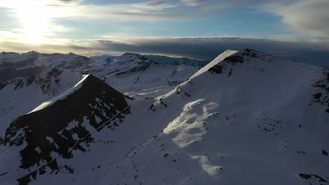 Striking-aerial-view-over-snow-covered-mountains,-pristine-Italian-alpine-region