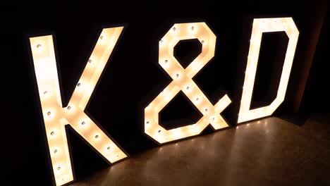 K-and-D-letter-lights-at-a-wedding-reception---Slow-Motion