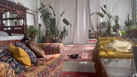 Relaxing-scene-of-artist-loft-living-room,-unique-bohemian-style-interior-studio