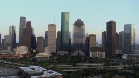 High-angle-drone-view-of-downtown-Houston,-Texas-and-surrounding-landscape