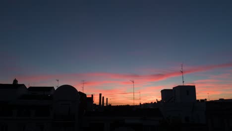 Beautiful-soft-color-palette-Summer-sunset-and-sky-seen-in-downtown-Madrid,-Spain