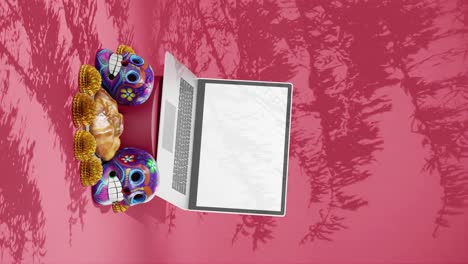 Day-of-The-Dead-Festival,-Dia-de-Muertos-,-Design-Mockup,-Laptop,-Template,-Mexico,-Skulls,-Traditional-Floral-and-Pastry,-Red-Background,-Vertical
