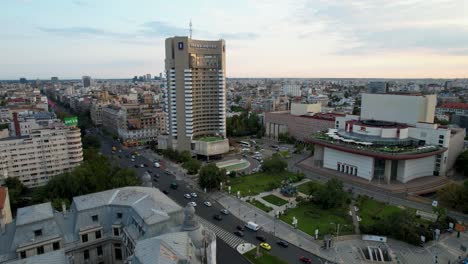 Aerial-View-Over-University-Square-In-Bucharest,-Romania-At-Sunset