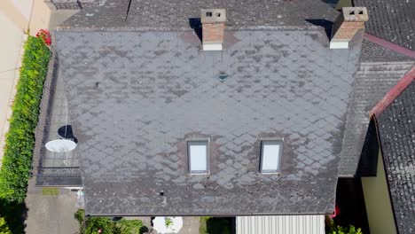 Top-View-Of-Eternit-Roof-Covering-Of-A-House---drone-shot