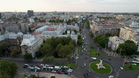 A-Bird’s-Eye-View-of-University-Square-in-Bucharest,-Romania,-Cars-In-Roundabout