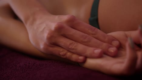 Close-shot-of-fingers-massaging-a-girl's-arm