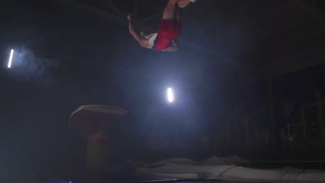 Gymnast-gymnastic-somersault-exercise-HD-slow-motion-video.-Athlete-salto