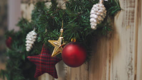Hand-of-woman-decorating-Christmas-tree-with-Christmas-glow-lights.