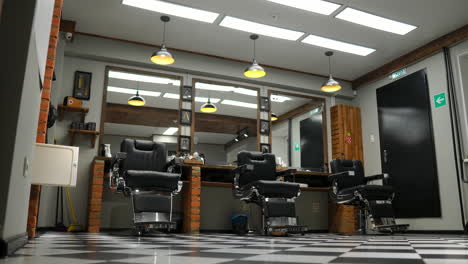 Vintage-hanging-lamps-in-hairdressing-salon.-Ceiling-retro-lamp-in-barber-shop.-Barber-pole.-Hair-salon-interior.-Metal-ceiling-lights-in-barbershop