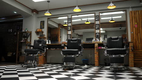 Interior-of-the-men's-Barber-shop-with-brick-walls-and-leather-chairs-with-chrome-handles