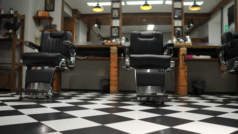 Interior-of-the-men's-Barber-shop-with-brick-walls-and-leather-chairs-with-chrome-handles