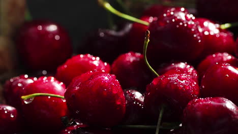 Red-ripe-sweet-cherries-close-up-with-drops-of-water-in-the-basket-on-the-grass