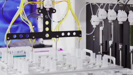 Close-up-of-the-robot-in-the-laboratory-injects-the-drug-catalyst-for-analysis-into-the-test-tube