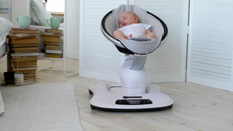 Modern-high-tech-rocking-chair-helps-parents-put-the-child-to-bed.-White-interior-of-children's-room
