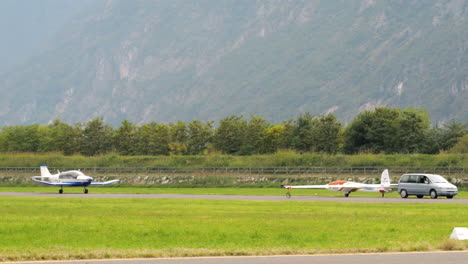 Van-carrying-aerobatic-Glider-with-Tow-plane-behind,-tracking-shot,-day