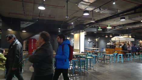 Truck-left-of-the-tables-and-services-to-be-offered-at-the-Tobalaba-Urban-Market-MUT-people-walking-and-enjoying-the-new-center-of-attraction-in-Santiago-Chile
