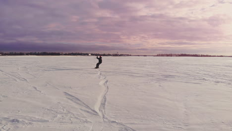 Kite-surfing-on-a-frozen-lake-in-winter-at-sunset