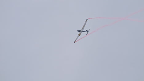 Glider-plane-performing-spin-maneuvers-in-aerobatics-flight-at-airshow