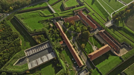Terezin-Czechia-Aerial-v2-birds-eye-view-drone-flyover-and-around-historical-landmark,-the-grounds-of-Theresienstadt-Concentration-Camp-in-Garrison-town---Shot-with-Mavic-3-Cine---November-2022