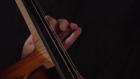 close-up-of-woman's-hand-playing-the-cello-using-vibrato-and-trill