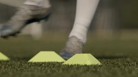 Close-shot-of-a-soccer-player-dribbling-the-ball-around-in-super-slow-motion
