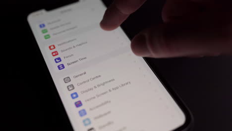 Checking-iOS-17-firmware-update-in-the-settings-of-an-iPhone-XS-Max