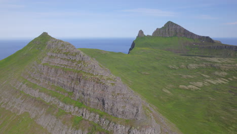Drone-flying-above-ridge-in-Hornstrandir-wilderness-in-summer,-Located-in-the-arctic-circle-in-Westfjords,-Iceland