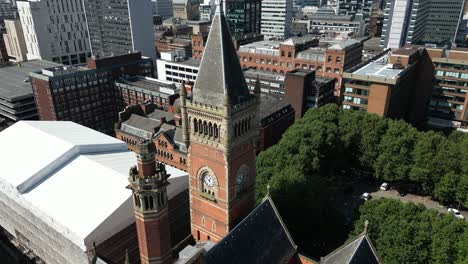 Aerial-drone-flight-circling-around-the-rooftop-Clocktower-of-Manchester-Crown-Court-on-Minshull-Street