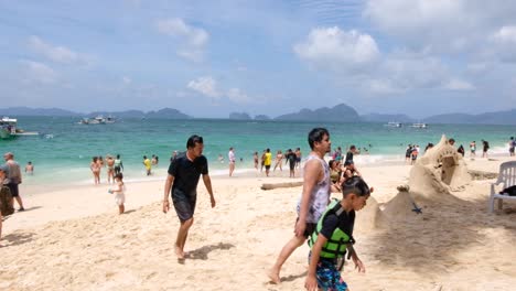Tourist-and-people-on-popular-Seven-Commandos-Beach-during-island-hopping-tour-in-El-Nido,-Palawan,-Philippines
