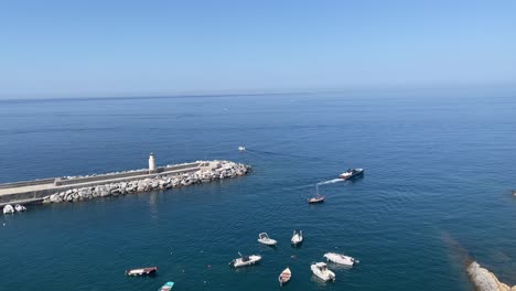 Scene-of-moving-boats-navigating-on-the-sea-waters-in-Camogli,-Italy