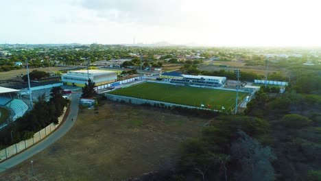 SDK-Stadion-Ergilio-Hato-football-stadium-side-field-in-curacao,-drone-dolly-push-in