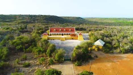 Aerial-dolly-to-Landhuis-brievengat-landhouse-of-curacao-overlooking-plantation-grounds