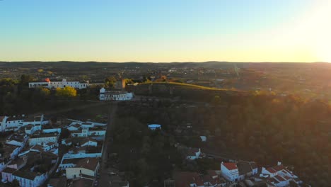 Drone-shot-of-a-medievel-tower-on-a-ridge-or-a-hill-in-Alentejo,-Portugal