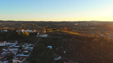 ONe-more-drone-shot-of-a-tower-on-a-hill-in-the-sunset