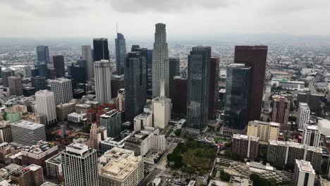 Aerial-view-in-front-of-the-skyline-of-downtown-of-Los-Angeles,-California,-USA