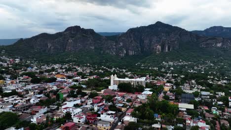 Aerial-view-over-the-Parroquia-Nuestra-Señora-de-la-Natividad-in-Tepoztlan,-Morelos,-Mexico