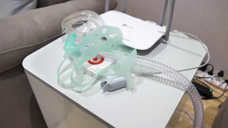 Slow-motion-shot-of-an-oxygen-mask-and-tubing-connected-to-a-high-altitude-simulator