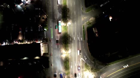 Top-down-aerial-street-view-at-night-with-light-traffic,-Christchurch